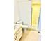 Bathroom with vanity, toilet, and glass enclosed shower with yellow tile at 717 Cordova Green, Seminole, FL 33777