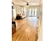 An open living area boasting wood floors, a stylish couch, and access to the outside at 717 Cordova Green, Seminole, FL 33777