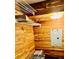 This storage room features a wooden paneled wall and shelves at 717 Cordova Green, Seminole, FL 33777