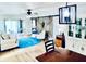 Open living space with barn door, comfortable seating, and wood-style flooring throughout at 717 Cordova Green, Seminole, FL 33777