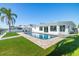 Stunning backyard with sparkling pool and waterfront views at 728 Pruitt Dr, Madeira Beach, FL 33708