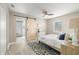 Cozy bedroom with a decorative rug and sliding barn door to the bathroom at 728 Pruitt Dr, Madeira Beach, FL 33708