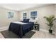This cozy bedroom with a large rug provides a relaxing space at 728 Pruitt Dr, Madeira Beach, FL 33708