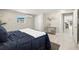 Cozy bedroom featuring a closet and doorway to the kitchen and dining area at 728 Pruitt Dr, Madeira Beach, FL 33708