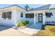 Charming property features modern design, with a minimalist landscape at 728 Pruitt Dr, Madeira Beach, FL 33708
