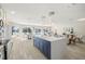Open-concept kitchen features a view of the dining and living areas at 728 Pruitt Dr, Madeira Beach, FL 33708