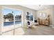Cozy living space with water views, sliding glass doors, and contemporary decor at 728 Pruitt Dr, Madeira Beach, FL 33708