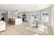 Modern living space featuring a kitchen island, dining area, and natural light at 728 Pruitt Dr, Madeira Beach, FL 33708