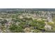 Beautiful aerial view of a residential community featuring mature trees and a winding canal at 8425 Jackson Springs Rd, Tampa, FL 33615