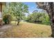 Tranquil backyard view with waterfront access and mature trees, perfect for relaxation at 8425 Jackson Springs Rd, Tampa, FL 33615