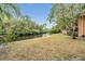 Spacious backyard features a waterfront view and a well-maintained grassy area at 8425 Jackson Springs Rd, Tampa, FL 33615