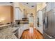 Modern kitchen featuring granite countertops, stainless steel appliances, and ample cabinet space for storage at 8425 Jackson Springs Rd, Tampa, FL 33615