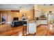 Inviting living space with hardwood floors, fireplace, and seamless flow to the modern kitchen at 8425 Jackson Springs Rd, Tampa, FL 33615