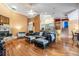 Bright open-concept living room with hardwood floors, fireplace, and seamless flow into other living spaces at 8425 Jackson Springs Rd, Tampa, FL 33615