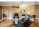 Cozy living room features a fireplace, hardwood floors, and ample space for comfortable seating at 8425 Jackson Springs Rd, Tampa, FL 33615