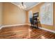 Bright office space with hardwood floors, a chandelier, and windows with shutters at 8425 Jackson Springs Rd, Tampa, FL 33615