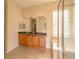 A luxurious bathroom featuring double sinks, a soaking tub, and a glass-enclosed shower at 1038 Emerald Dunes Dr, Sun City Center, FL 33573
