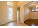 Inviting foyer with decorative glass door, tile floor and entry to adjacent room at 1038 Emerald Dunes Dr, Sun City Center, FL 33573