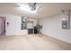 A clean and organized garage interior with cabinets and utility connections at 1038 Emerald Dunes Dr, Sun City Center, FL 33573