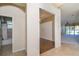 View down hallway to adjacent rooms including bathroom and carpeted area at 1038 Emerald Dunes Dr, Sun City Center, FL 33573