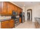 Updated kitchen with stainless steel appliances, tile backsplash and beautiful wood cabinets at 1038 Emerald Dunes Dr, Sun City Center, FL 33573