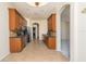 Spacious eat-in kitchen with long granite counters, wood cabinets and stainless appliances at 1038 Emerald Dunes Dr, Sun City Center, FL 33573