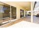 Covered patio with brick pavers, ceiling fan and multiple sliding glass door entrances at 1038 Emerald Dunes Dr, Sun City Center, FL 33573