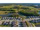 Extensive aerial view showing a large planned community featuring walking trails and lakes at 1044 Manzanar Pl, Wesley Chapel, FL 33543