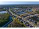 Extensive aerial view of a Primary planned community featuring multiple lakes and mature landscaping at 1044 Manzanar Pl, Wesley Chapel, FL 33543