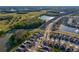 Extensive aerial view showing a large planned community featuring walking trails and lakes at 1044 Manzanar Pl, Wesley Chapel, FL 33543