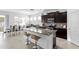 Spacious kitchen with a large island, stainless steel appliances, and adjacent dining area at 1044 Manzanar Pl, Wesley Chapel, FL 33543