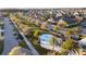 Scenic aerial of neighborhood featuring lush landscaping and splashpad at 1044 Manzanar Pl, Wesley Chapel, FL 33543