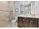 Modern bathroom featuring a glass shower, dark wood cabinets, and stylish fixtures at 1110 Overlook Ct, Bradenton, FL 34208