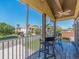 View from screened balcony with seating, overlooking tropical landscaping, and street view at 1140 81St S St, St Petersburg, FL 33707