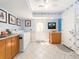 Laundry area in the basement, featuring tile floor, ample cabinet space and a bright, clean appearance at 1140 81St S St, St Petersburg, FL 33707