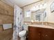 Cozy bathroom featuring a tiled shower and anchor-themed shower curtain for a nautical touch at 1140 81St S St, St Petersburg, FL 33707