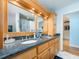 Stylish bathroom boasting a granite countertop, double sinks, and custom cabinetry at 1140 81St S St, St Petersburg, FL 33707