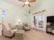 Bedroom with sitting area and french doors to the outside includes ceiling fan and vaulted ceiling at 1140 81St S St, St Petersburg, FL 33707
