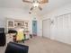 Bedroom with a vaulted ceiling, ceiling fan, desk and built-in shelves, offering ample space at 1140 81St S St, St Petersburg, FL 33707