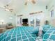 Bright bedroom with ceiling fan features french doors to the outside, with vaulted ceiling and television at 1140 81St S St, St Petersburg, FL 33707