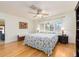 Light-filled bedroom with wood floors, complemented by ample natural light from large windows at 1140 81St S St, St Petersburg, FL 33707