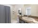 Bathroom with a shower, vanity, and grey finishes providing a clean and functional space at 1210 Cape Chestnut Pl, Ruskin, FL 33570