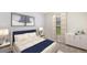 Bedroom featuring a plush bed, minimalist decor, and soft natural light creating a relaxing atmosphere at 1210 Cape Chestnut Pl, Ruskin, FL 33570