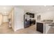 Modern kitchen with stainless steel appliances, dark cabinets, granite countertops and an island with seating at 1210 Cape Chestnut Pl, Ruskin, FL 33570