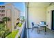 Balcony featuring a seating area and overlooking the complex, landscaping, and ocean at 12924 Gulf Blvd # 310, Madeira Beach, FL 33708