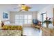 Bright bedroom featuring two beds, a flat screen television, and balcony access at 12924 Gulf Blvd # 310, Madeira Beach, FL 33708