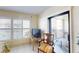 Bedroom with shuttered windows and sliding glass doors to balcony area at 12924 Gulf Blvd # 310, Madeira Beach, FL 33708
