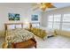 Bedroom featuring two beds, ceiling fan, and a bench at the end of one of the beds at 12924 Gulf Blvd # 310, Madeira Beach, FL 33708