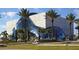 Exterior shot of the Dali Museum showcasing its modern architectural design, glass features and tropical landscaping at 12924 Gulf Blvd # 310, Madeira Beach, FL 33708
