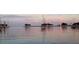A calm waterfront view featuring sailboats anchored near the shore at 12924 Gulf Blvd # 310, Madeira Beach, FL 33708